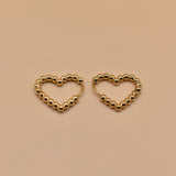 Gold heart huggies hoop earrings with charm design