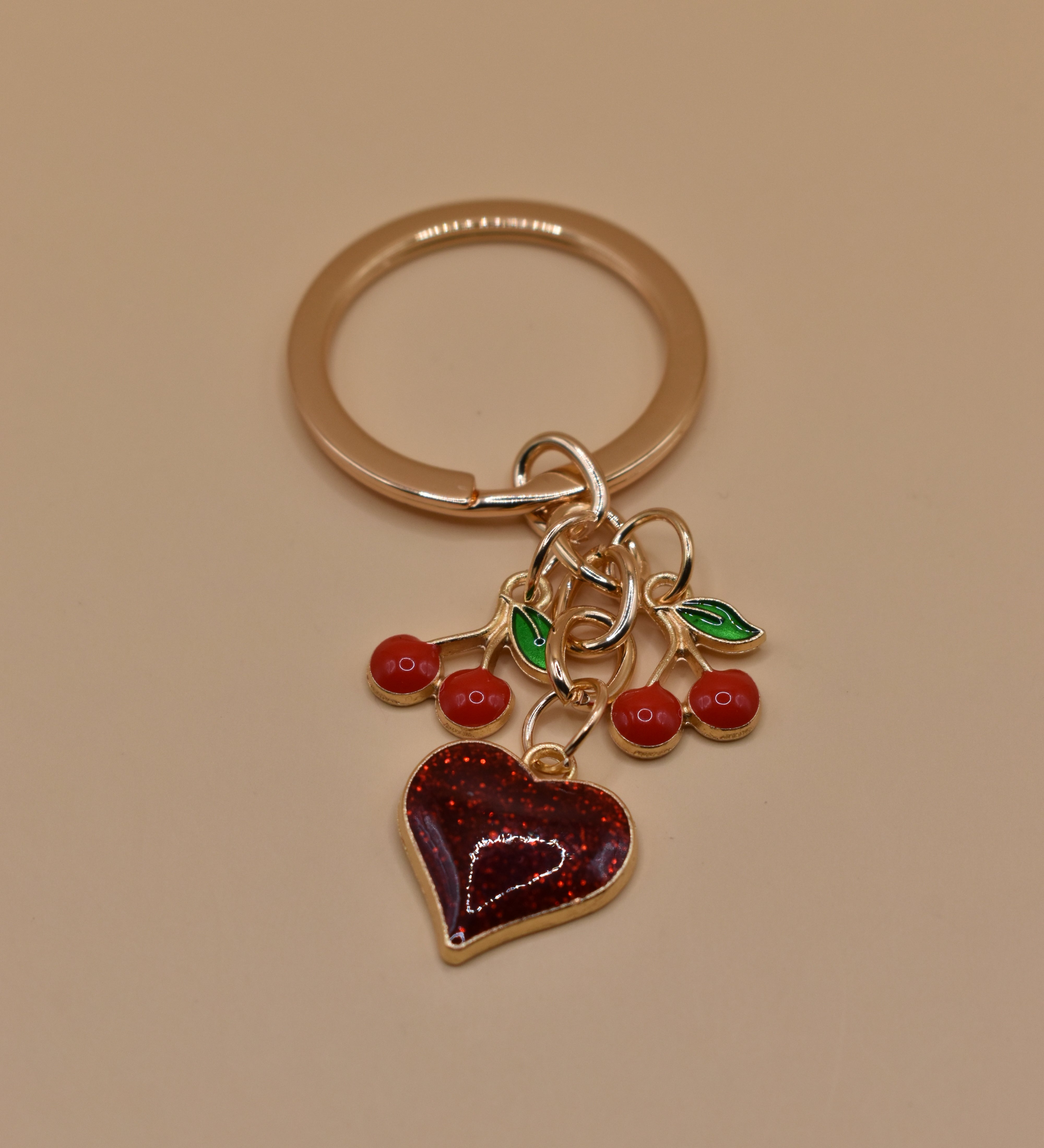Cherry bag charm keychain with red gloss and heart detail