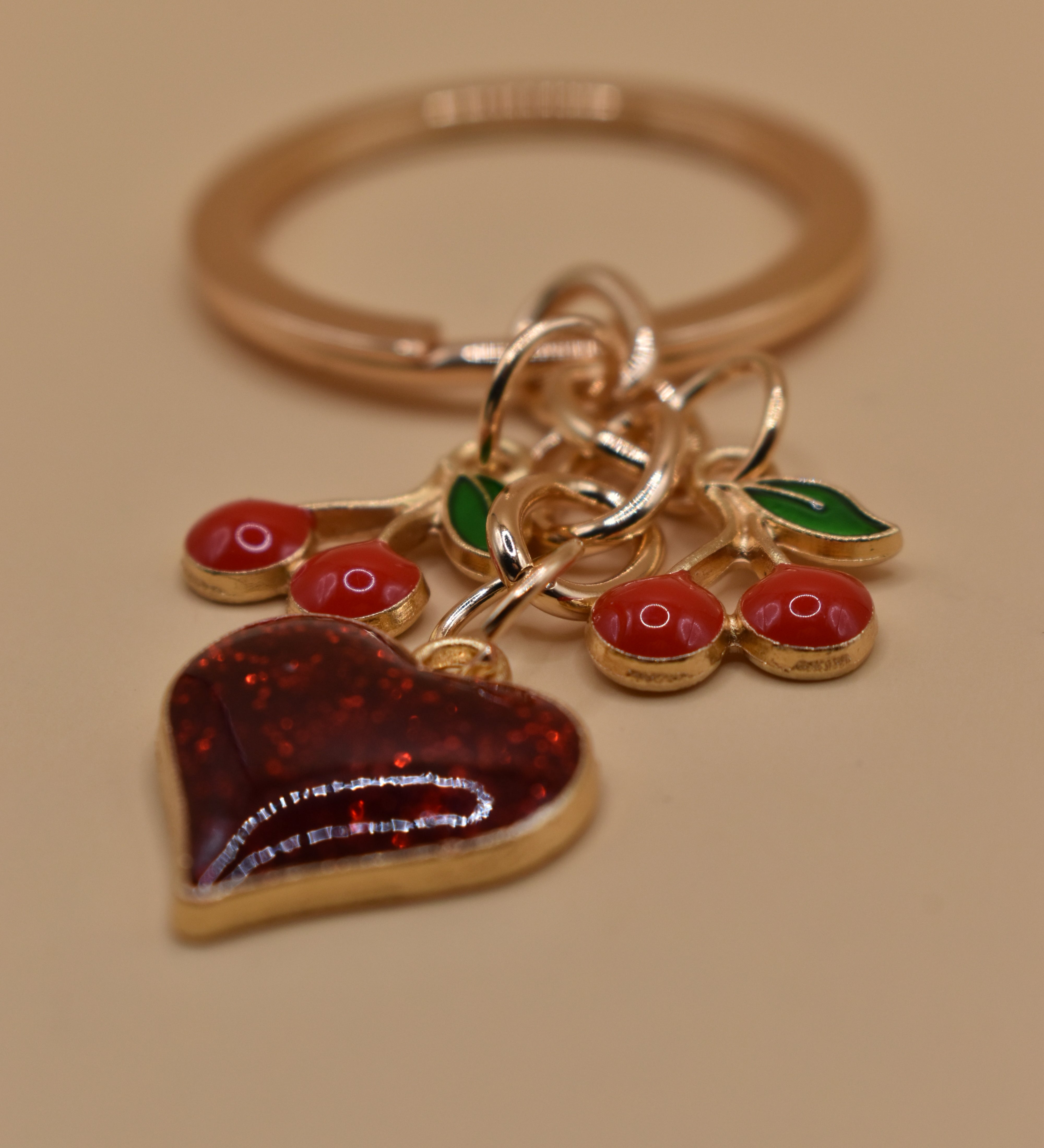 Cherry bag charm keychain with red gloss and heart detail