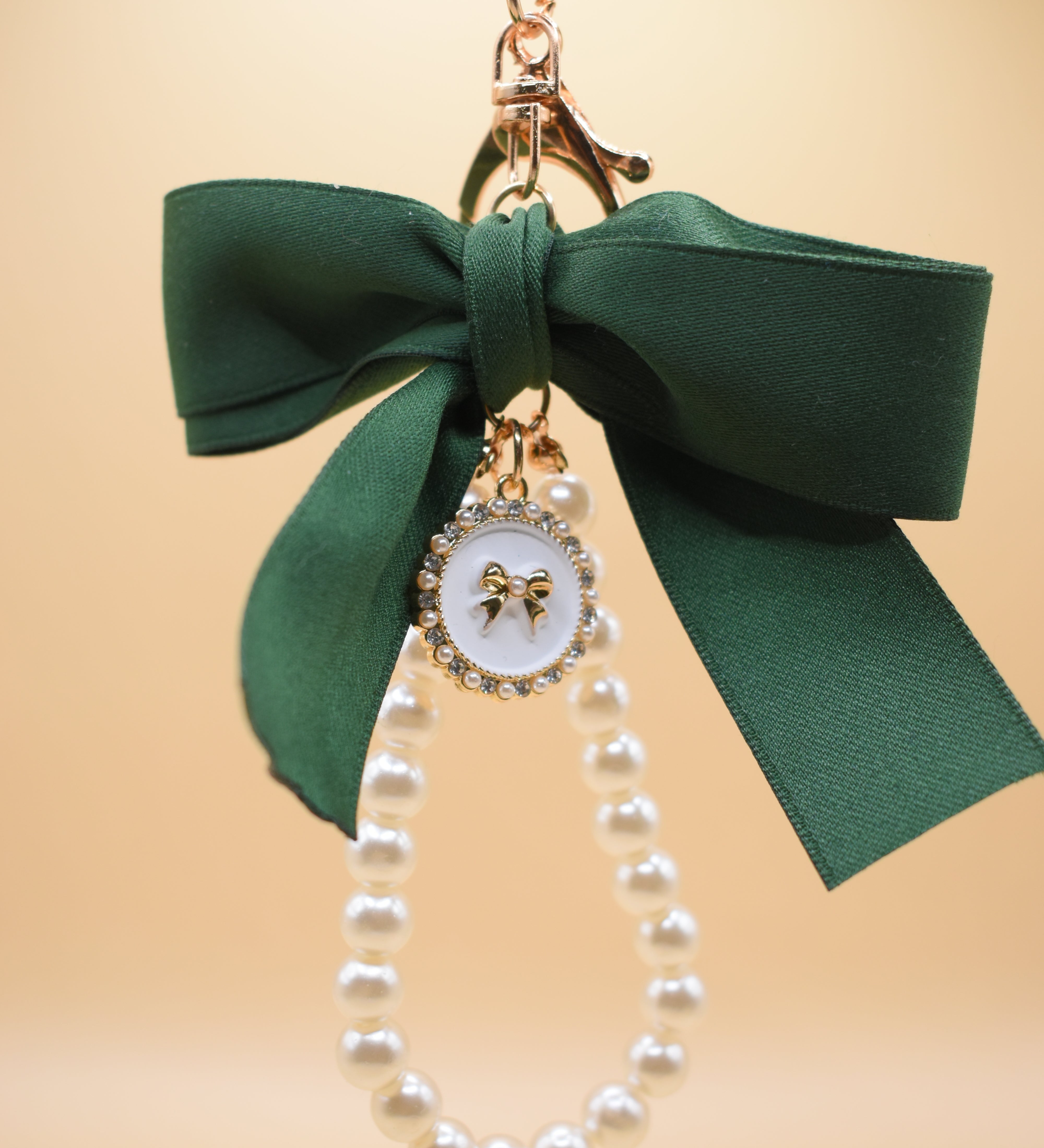 Gold bow with pearl bag charm clip accessory
