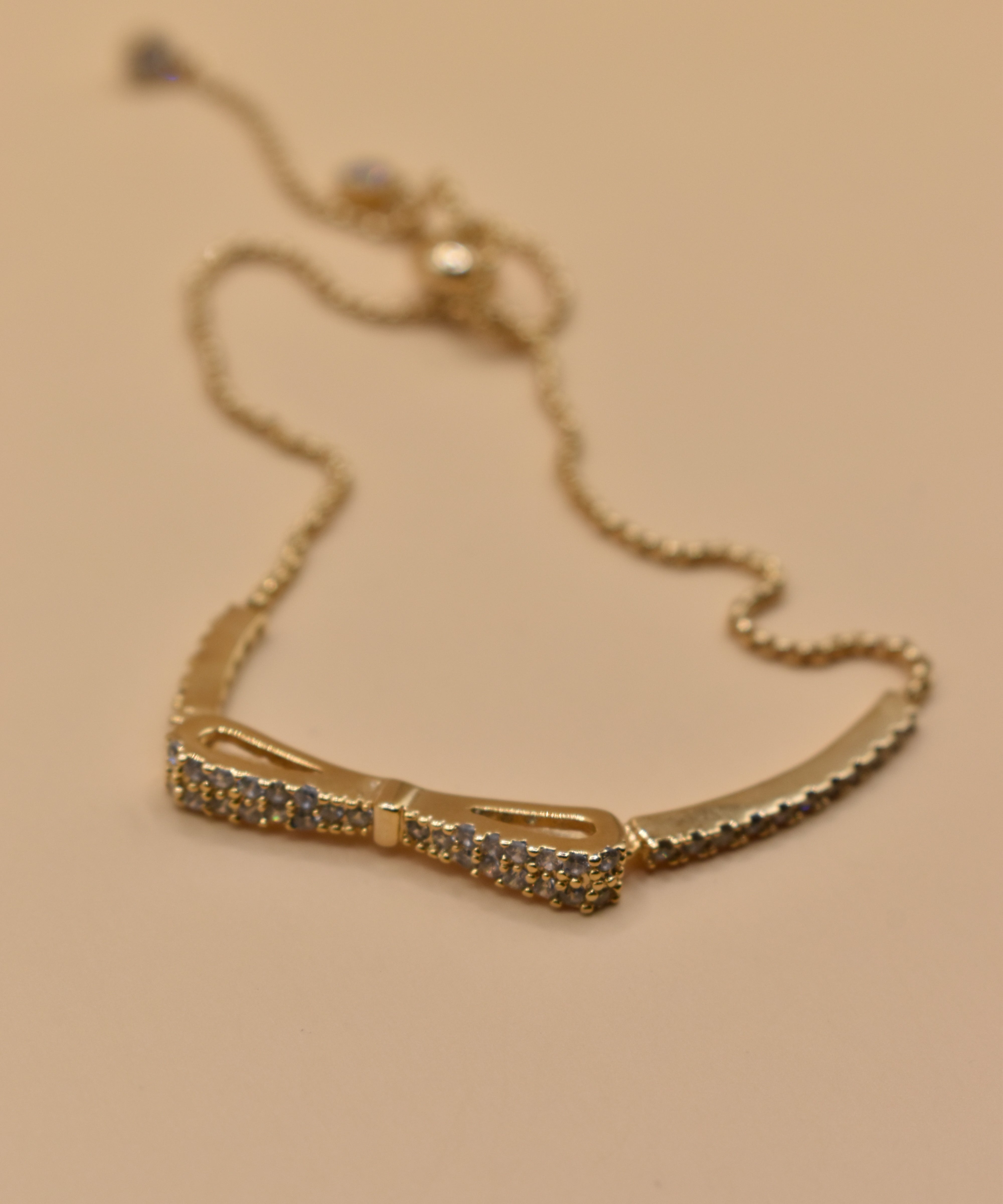 Gold Bow CZ Bracelet Adjustable with cubic zirconia charm