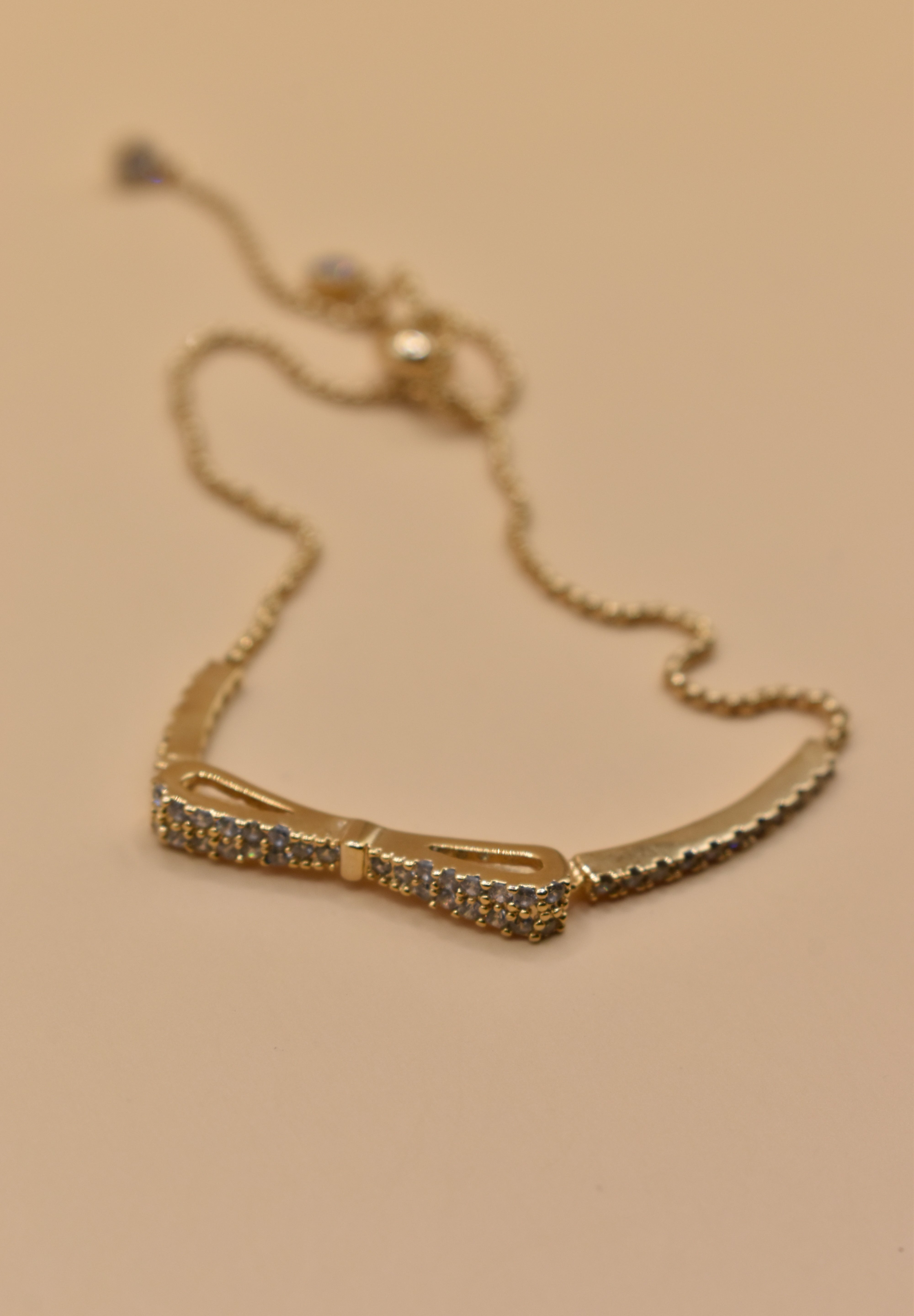 Gold Bow CZ Bracelet Adjustable with cubic zirconia charm