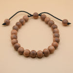 Adjustable handmade bead bracelet with wood accents