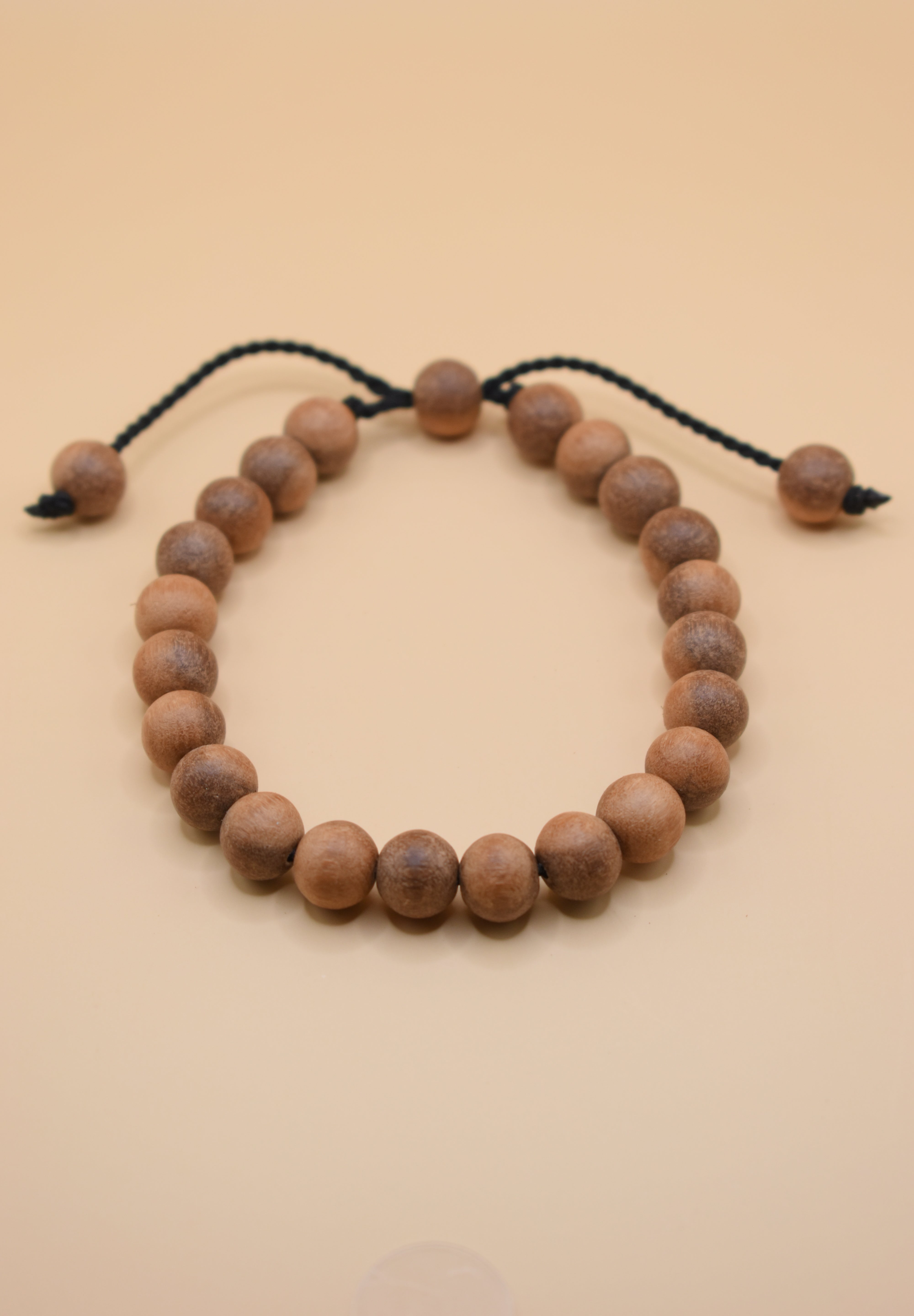 Adjustable handmade bead bracelet with wood accents