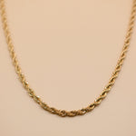 Gold rope necklace with twisted chain design