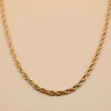Gold rope necklace with twisted chain design