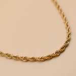 Gold rope necklace with twisted chain design