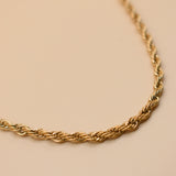 Gold rope necklace with twisted chain design