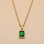 Green pendant necklace with gold chain and inlay stone
