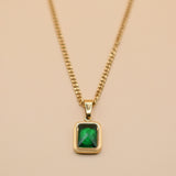 Green pendant necklace with gold chain and inlay stone