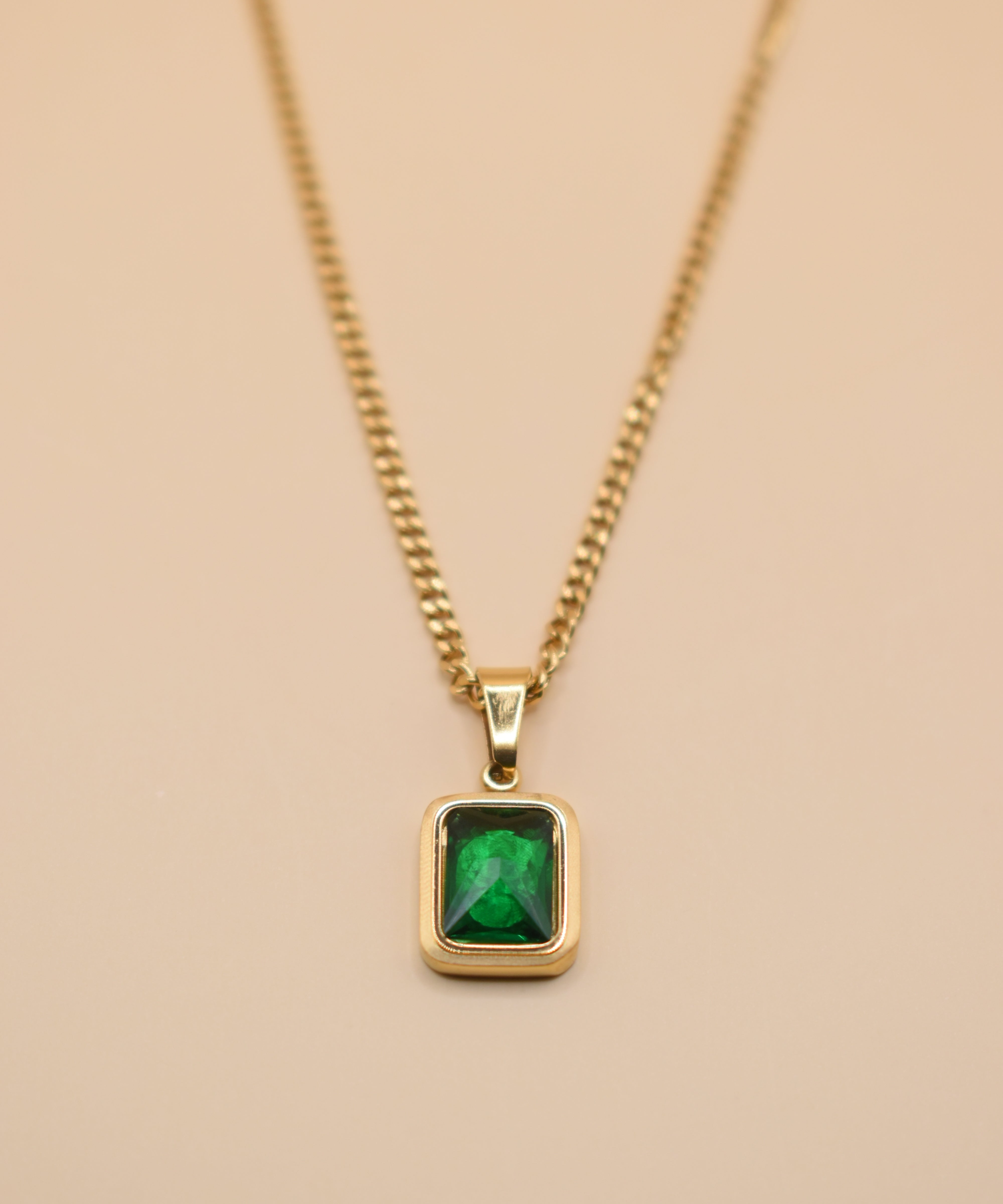 Green pendant necklace with gold chain and inlay stone