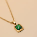 Green pendant necklace with gold chain and inlay stone