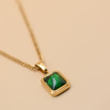 Green pendant necklace with gold chain and inlay stone