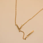 Gold pendant drop necklace with minimalist V-shape chain