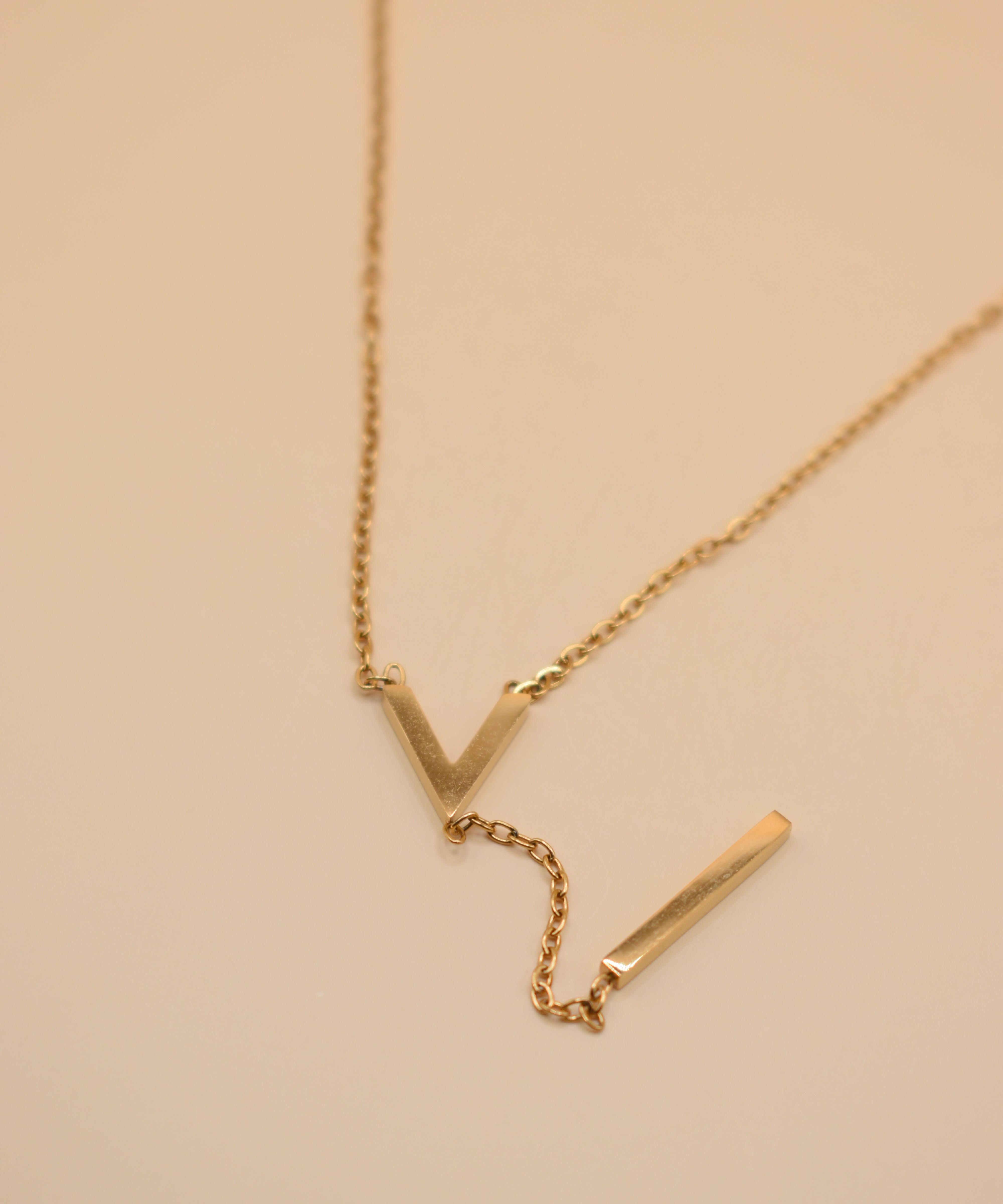 Gold pendant drop necklace with minimalist V-shape chain