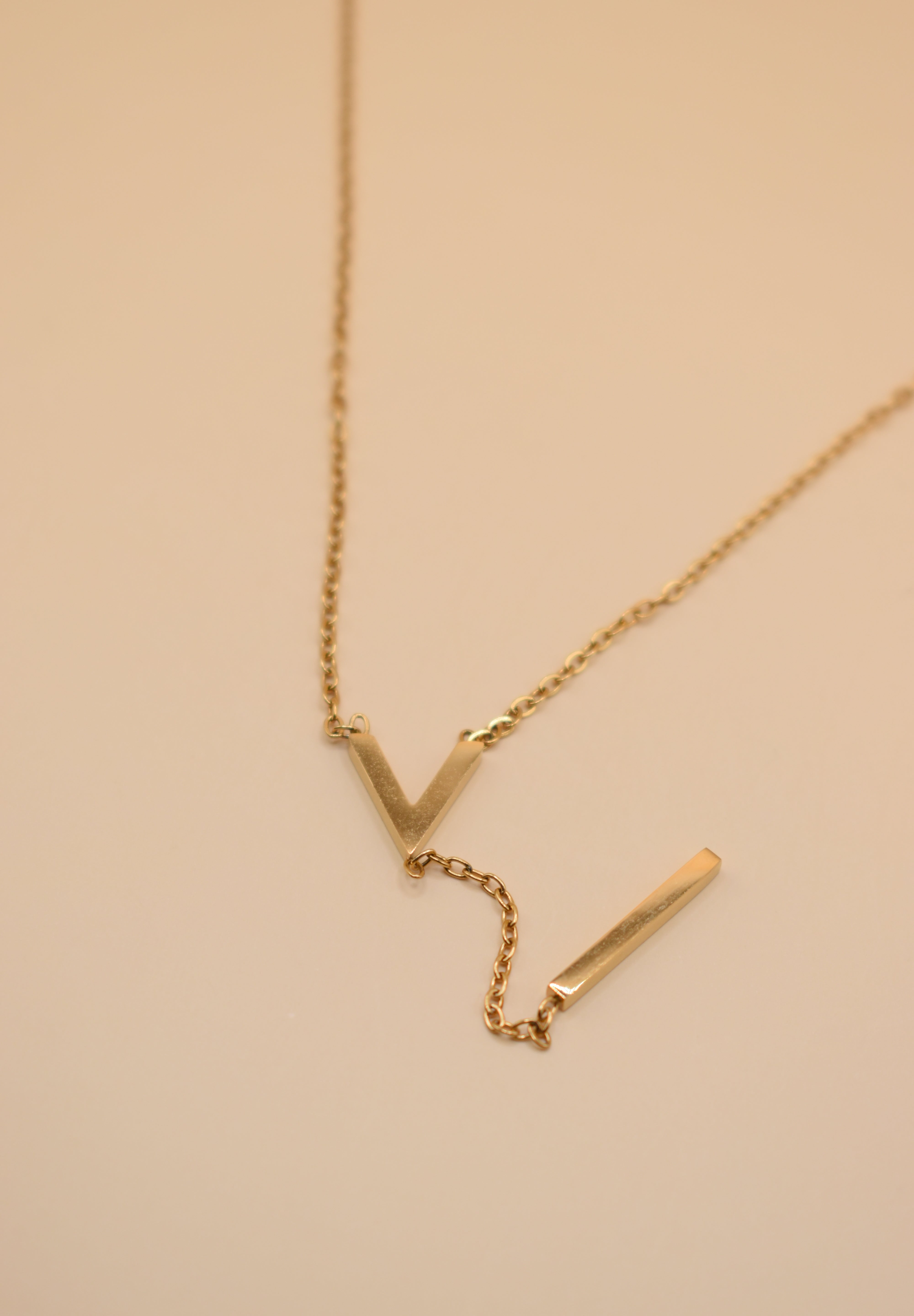 Gold pendant drop necklace with minimalist V-shape chain