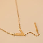 Gold pendant drop necklace with minimalist V-shape chain