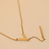 Gold pendant drop necklace with minimalist V-shape chain