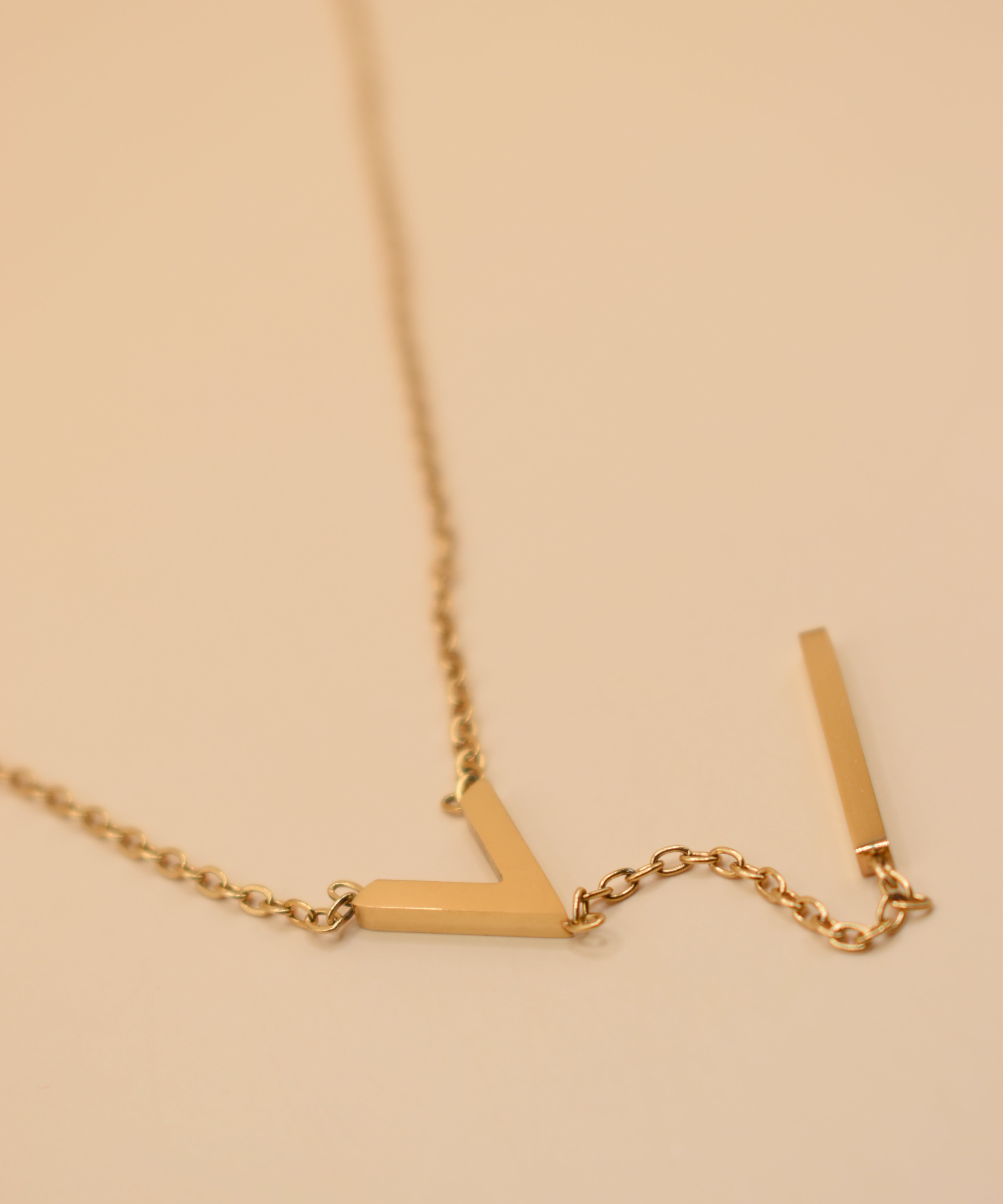 Gold pendant drop necklace with minimalist V-shape chain