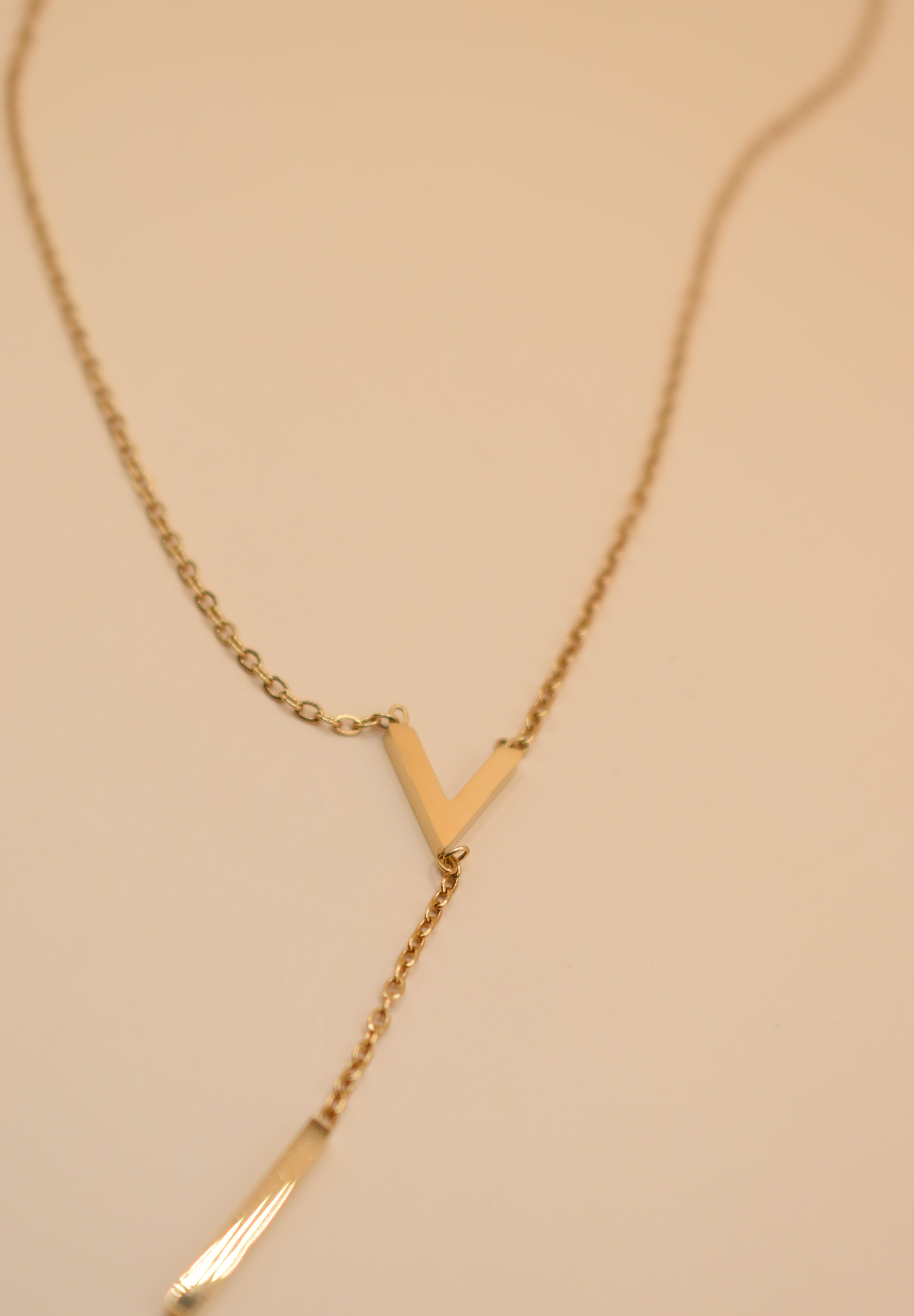 Gold pendant drop necklace with minimalist V-shape chain