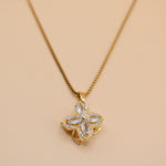 Gold clover pendant necklace with rotating charm