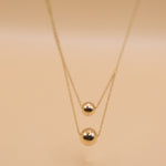 Gold double ball layered necklace with dainty chain
