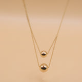 Gold double ball layered necklace with dainty chain